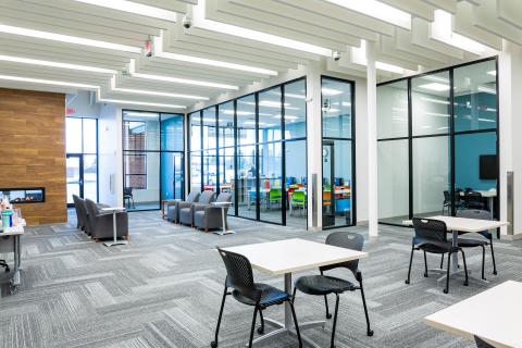 Glass walled study rooms on either side of Homework Help Center