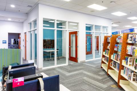 Study rooms side-by-side with glass walls and seating