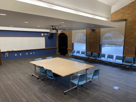 Table and chairs set up in Owl Meeting Room